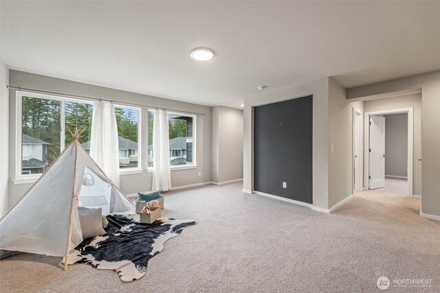 playroom with baseboards and carpet floors