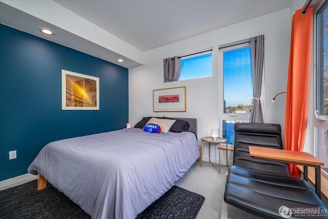 carpeted bedroom with baseboards and recessed lighting