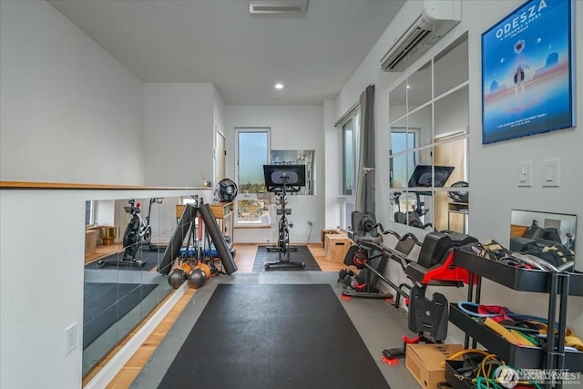 workout room with recessed lighting and an AC wall unit