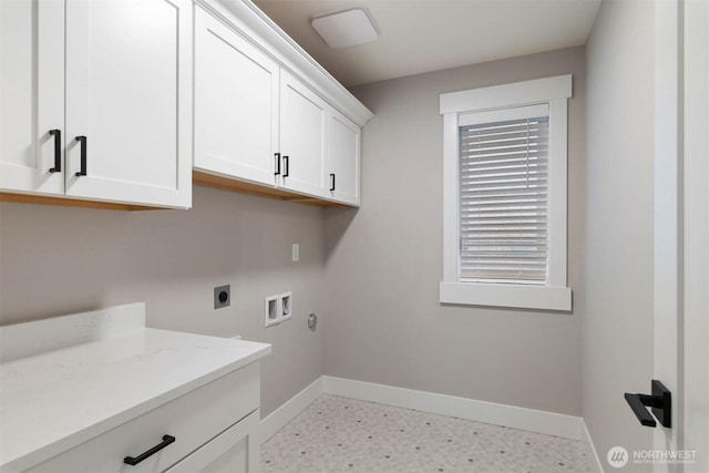 clothes washing area featuring baseboards, hookup for a washing machine, cabinet space, and hookup for an electric dryer