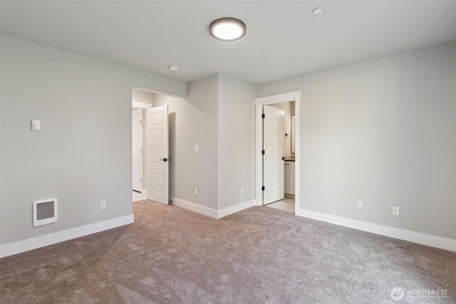 unfurnished bedroom featuring light carpet, baseboards, and visible vents