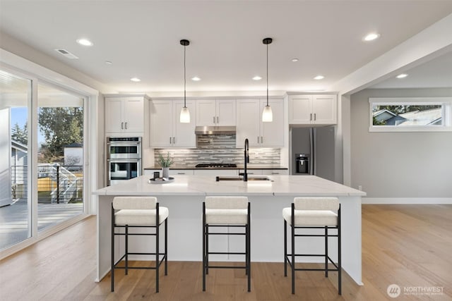 kitchen with plenty of natural light, visible vents, appliances with stainless steel finishes, and a sink