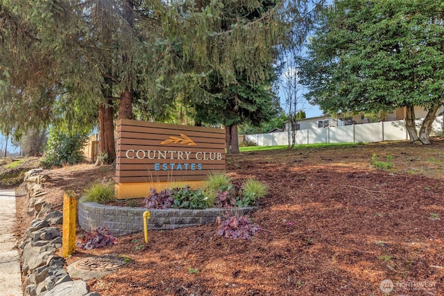 community sign with fence