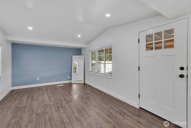 entrance foyer with baseboards, vaulted ceiling, dark wood-type flooring, and recessed lighting