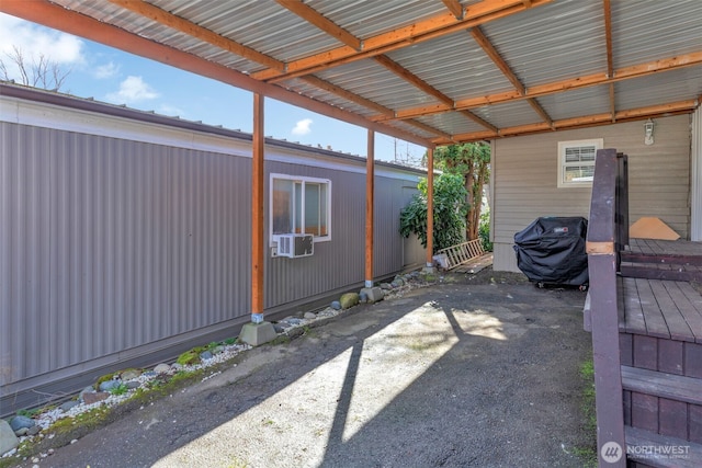 view of patio / terrace featuring an attached carport and cooling unit