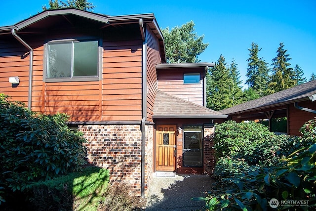 exterior space featuring brick siding