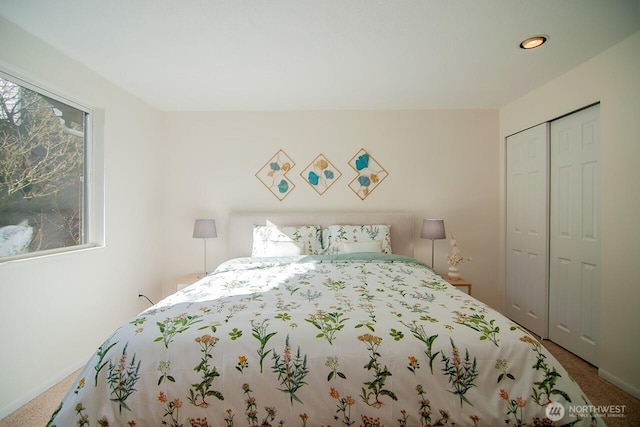 carpeted bedroom featuring a closet