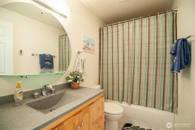 bathroom with shower / bath combination with curtain, vanity, and toilet