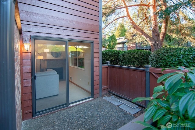 doorway to property with fence