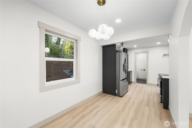 interior space featuring light wood-style floors, recessed lighting, and baseboards