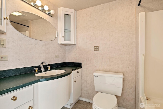 full bathroom featuring vanity and toilet