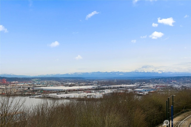 exterior space featuring a water and mountain view