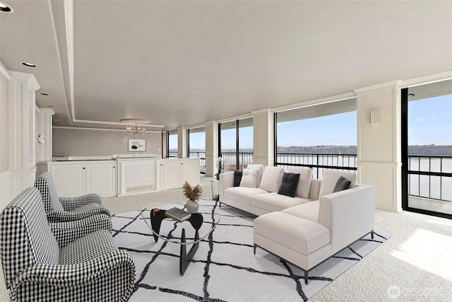 living area featuring expansive windows and light colored carpet