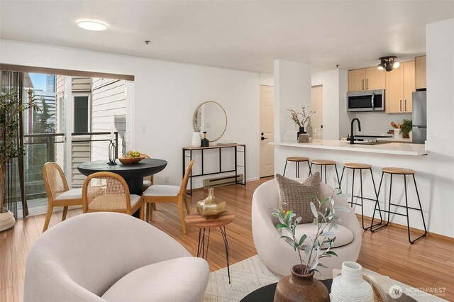 living room featuring light wood-style flooring