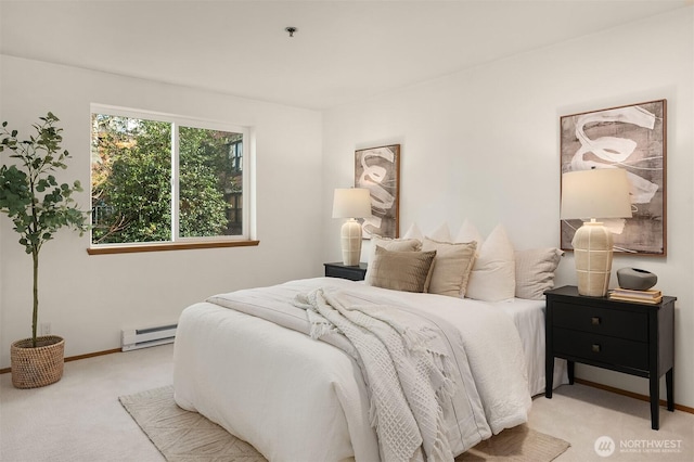 carpeted bedroom featuring a baseboard radiator and baseboards