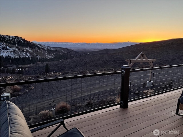 deck at dusk with a mountain view