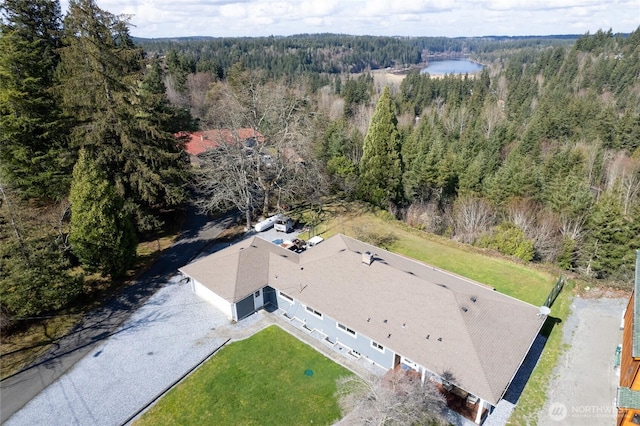 bird's eye view featuring a wooded view