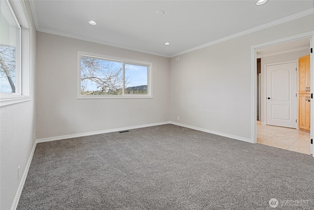 empty room with recessed lighting, light colored carpet, crown molding, and baseboards