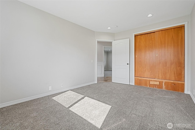 unfurnished bedroom featuring carpet, baseboards, and recessed lighting