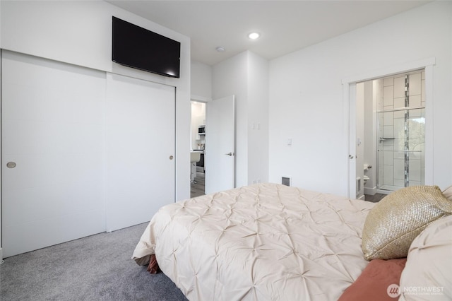 carpeted bedroom featuring recessed lighting, visible vents, and ensuite bathroom