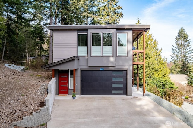 contemporary house with a garage and concrete driveway