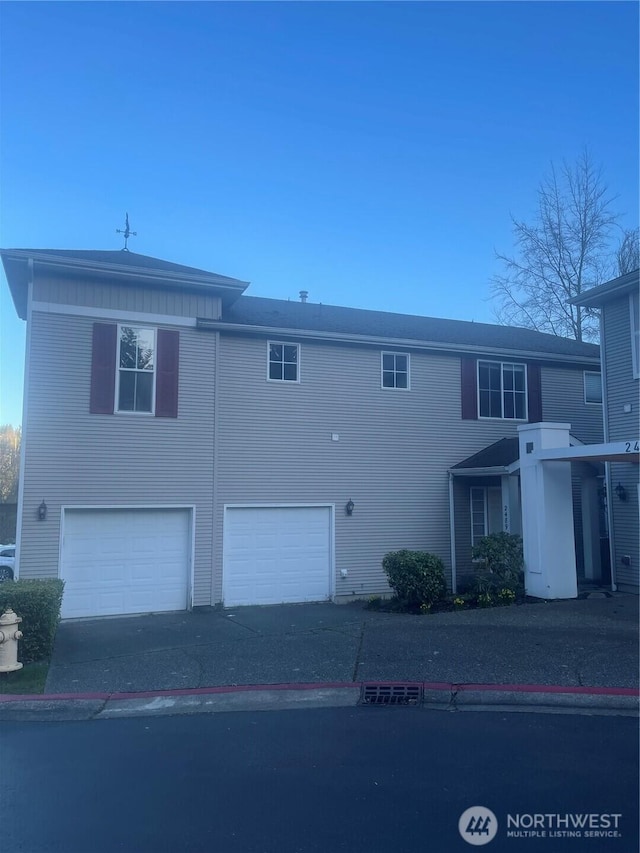 view of front facade with driveway and an attached garage