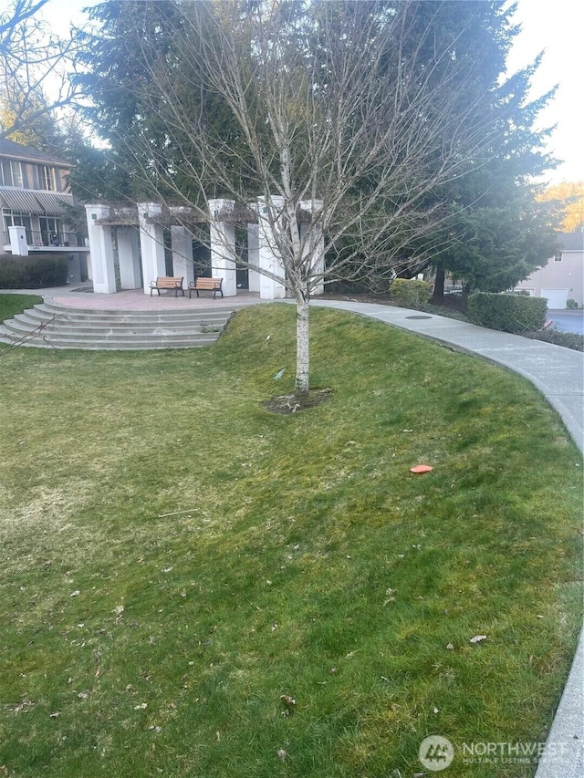 exterior space featuring a lawn and a patio