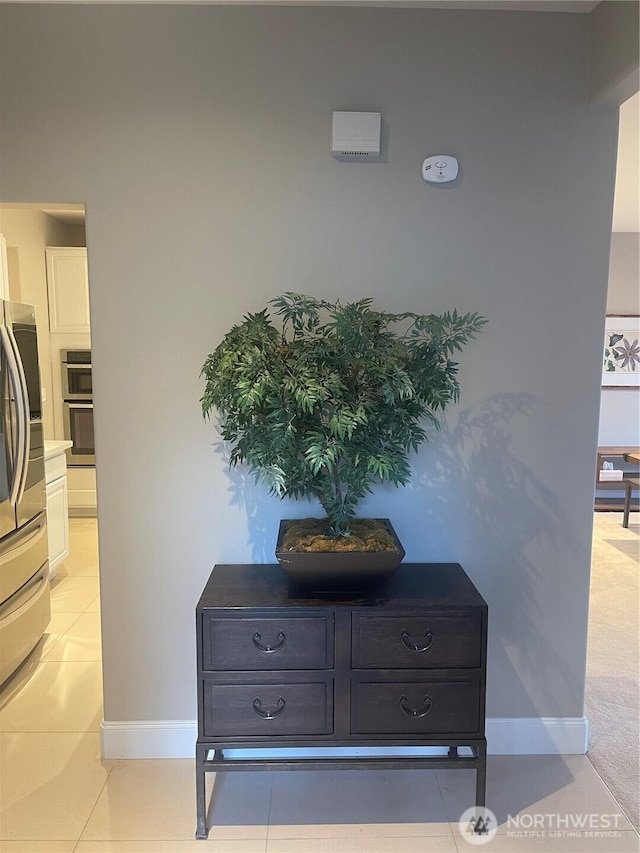 details featuring stainless steel appliances and baseboards