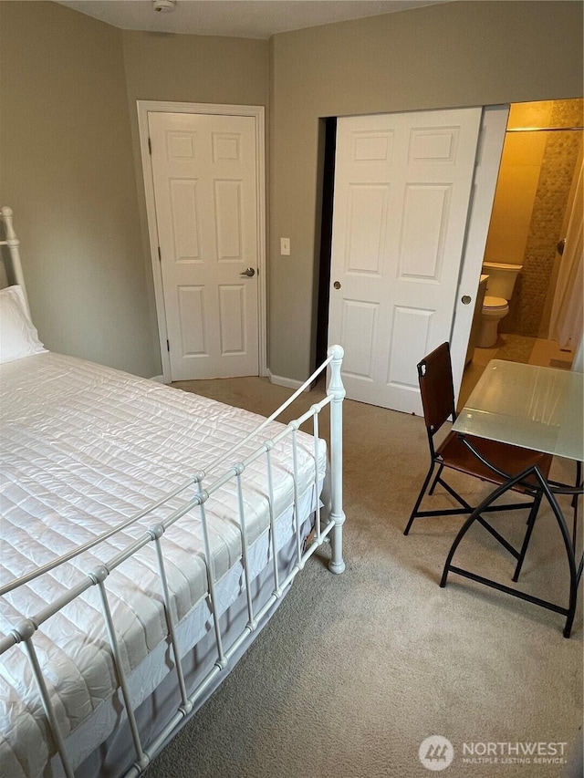 bedroom featuring a closet and carpet flooring