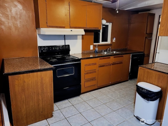 kitchen featuring a sink, under cabinet range hood, black appliances, and light tile patterned floors