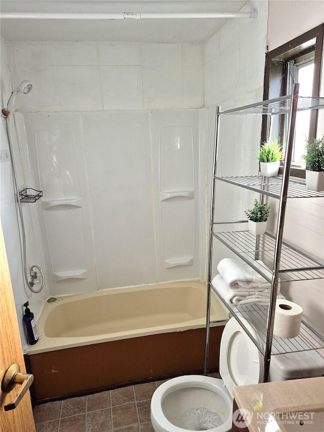 full bathroom with bathing tub / shower combination and toilet