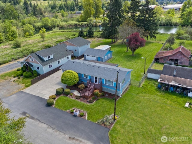 birds eye view of property with a water view