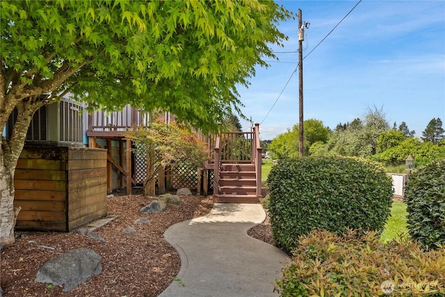 view of yard with stairs and a wooden deck