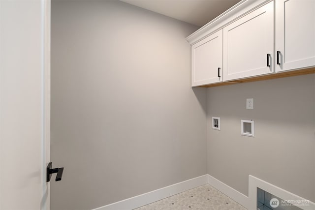 washroom with cabinet space, hookup for a washing machine, and baseboards