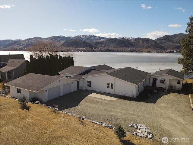 birds eye view of property featuring a mountain view