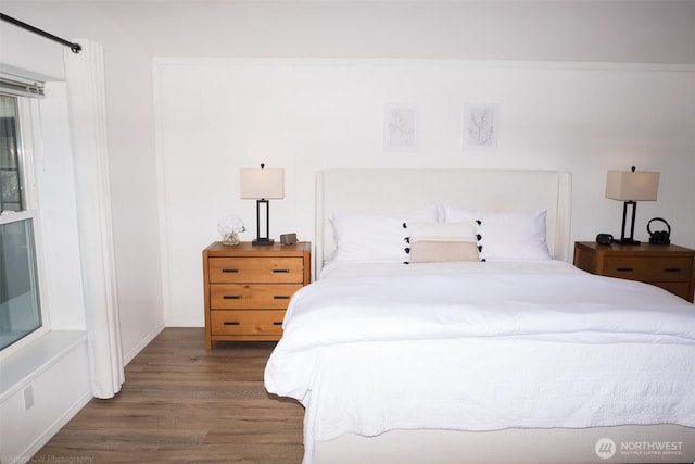 bedroom with wood finished floors