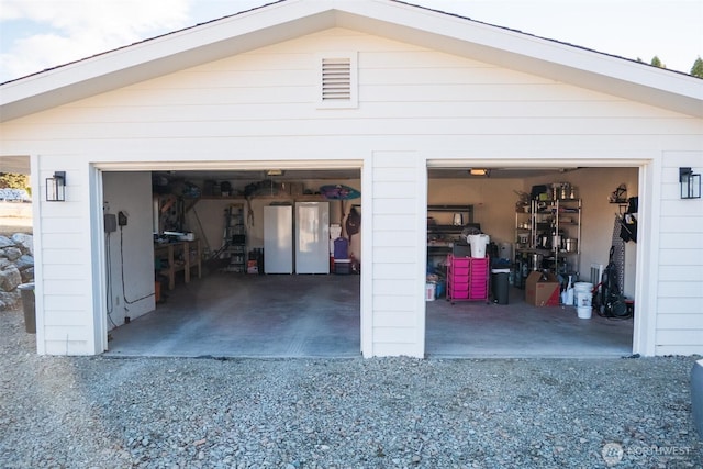 detached garage featuring freestanding refrigerator