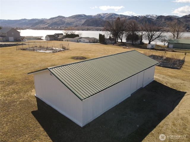 exterior space featuring a water and mountain view