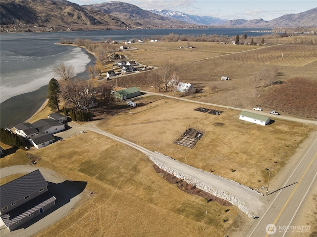 aerial view featuring a rural view and a mountain view