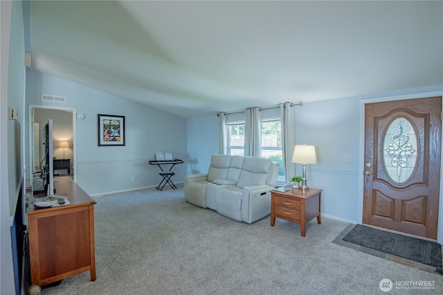 carpeted living area featuring vaulted ceiling, visible vents, and baseboards