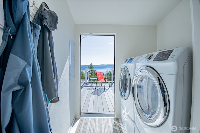 laundry room featuring laundry area, a mountain view, and washer and clothes dryer