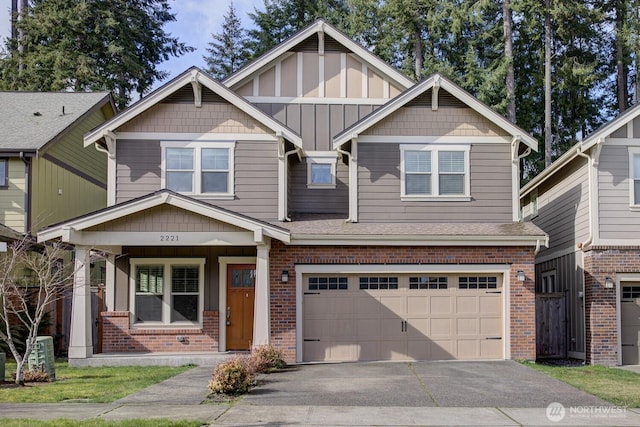 view of front of home with brick siding, board and batten siding, an attached garage, and aphalt driveway