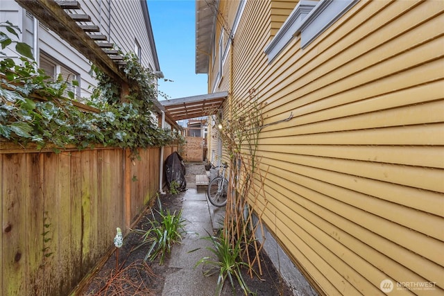 view of property exterior featuring fence