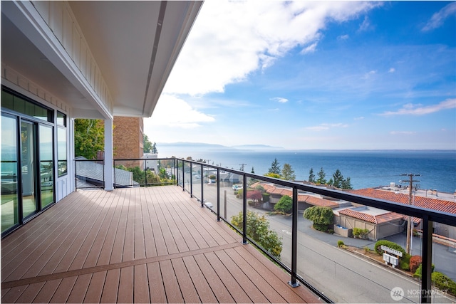 wooden deck featuring a water view