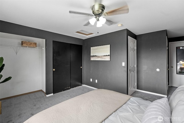 bedroom with a ceiling fan, attic access, carpet, and baseboards