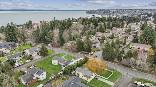 drone / aerial view featuring a water view and a residential view