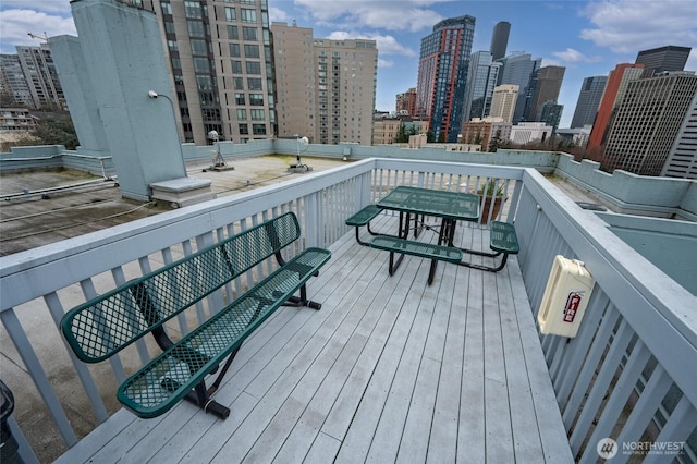 wooden deck featuring a city view