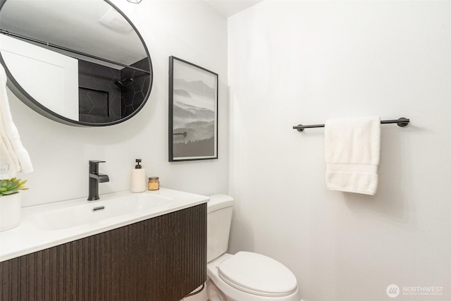 bathroom with vanity and toilet