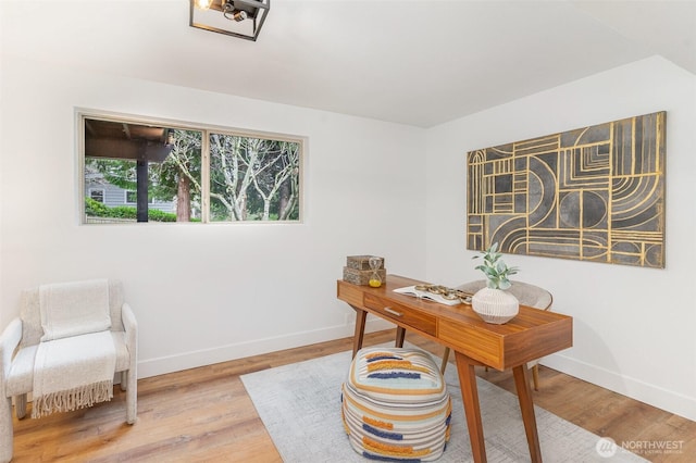 office area featuring wood finished floors and baseboards