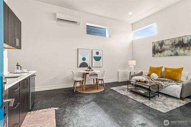 living room with recessed lighting, baseboards, and a wall mounted air conditioner